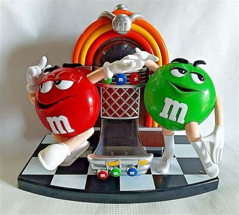 Vintage M&M Football Player Candy Dispenser, Red Peanut Character, Working Dispenser, Moving Passing Arm Dispenses Candy Through The Helmet (167) 27. . Vintage mm dispenser